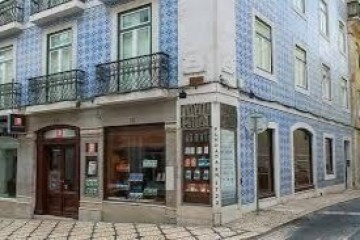 a view of a city street in front of a brick building