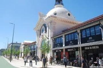 a group of people walking in front of a building