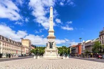 a large clock tower towering over a city