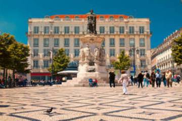 a group of people walking on a city street