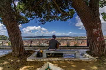 a bench next to a body of water