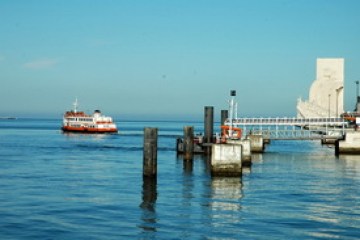 a boat is docked next to a body of water